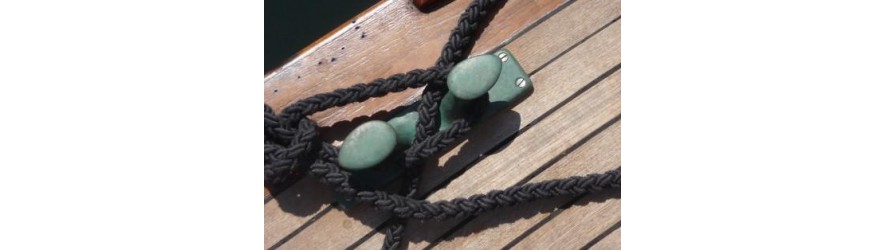 Bronze, brass and wooden cleats and bollards